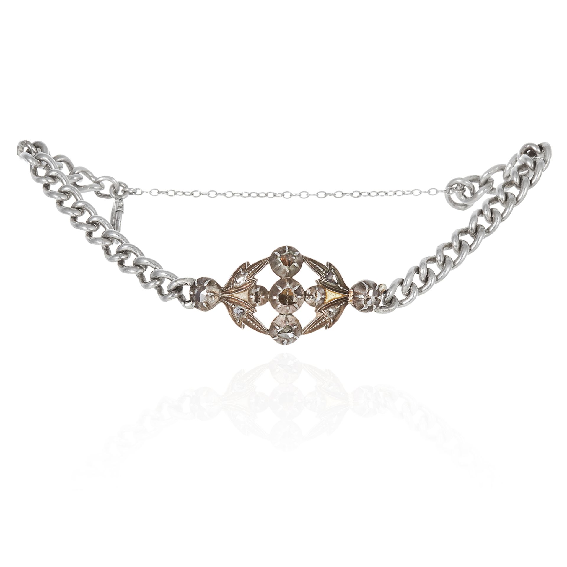 A DIAMOND BRACELET in silver, the scrolling and floral motif centre jewelled with rose cut diamonds,