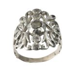 AN ANTIQUE DIAMOND DRESS RING in yellow gold and silver, set with a central rose cut diamond