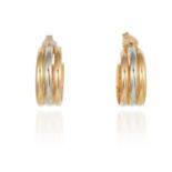 AN VINTAGE TRINITY DE CARTIER RING AND EARRINGS SUITE in 18ct gold, each formed of a trio of