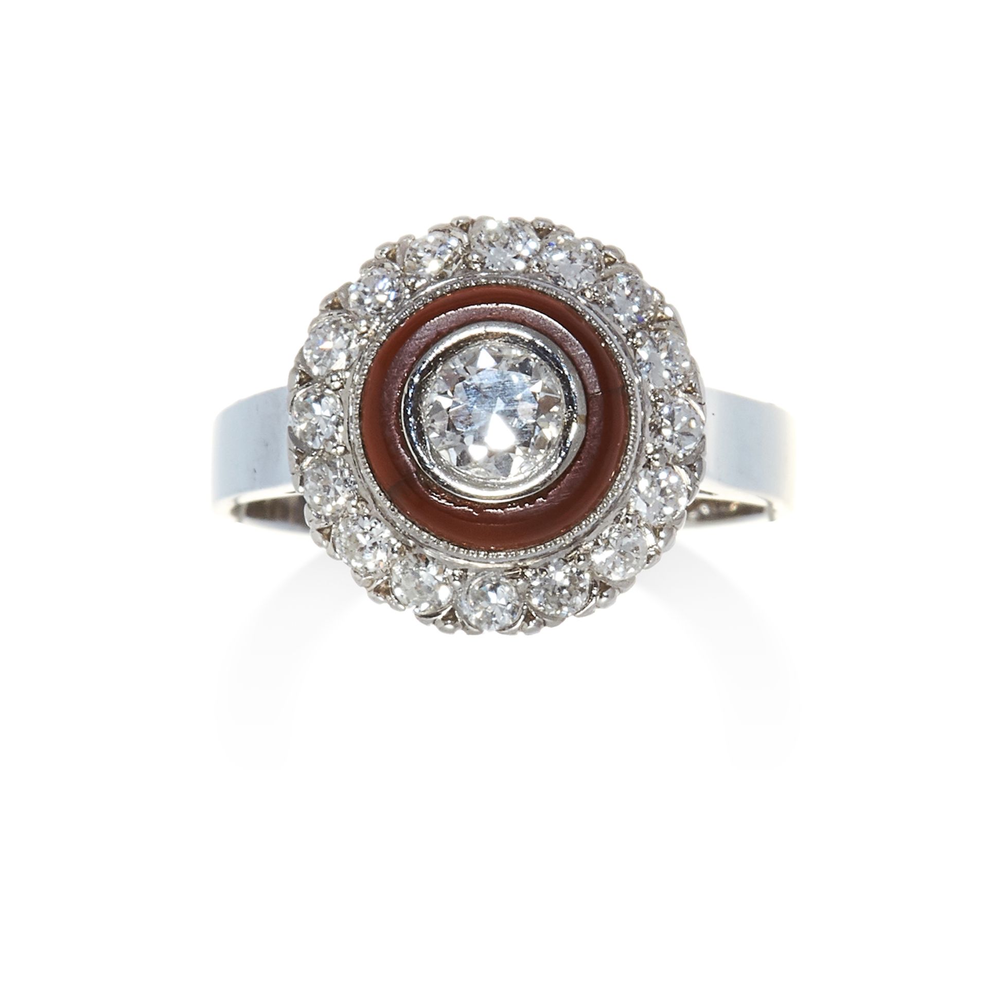 A DIAMOND AND HARDSTONE RING in white gold, set with a central round cut diamond to a hardstone