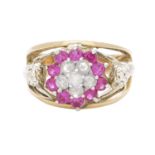 A VINTAGE RUBY AND DIAMOND DRESS RING, CIRCA 1940 in yellow gold, the floral motif centre jewelled