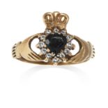 A JEWELLED CLADDAGH RING in yellow gold, set with a jewelled heart motif, set below a crown and