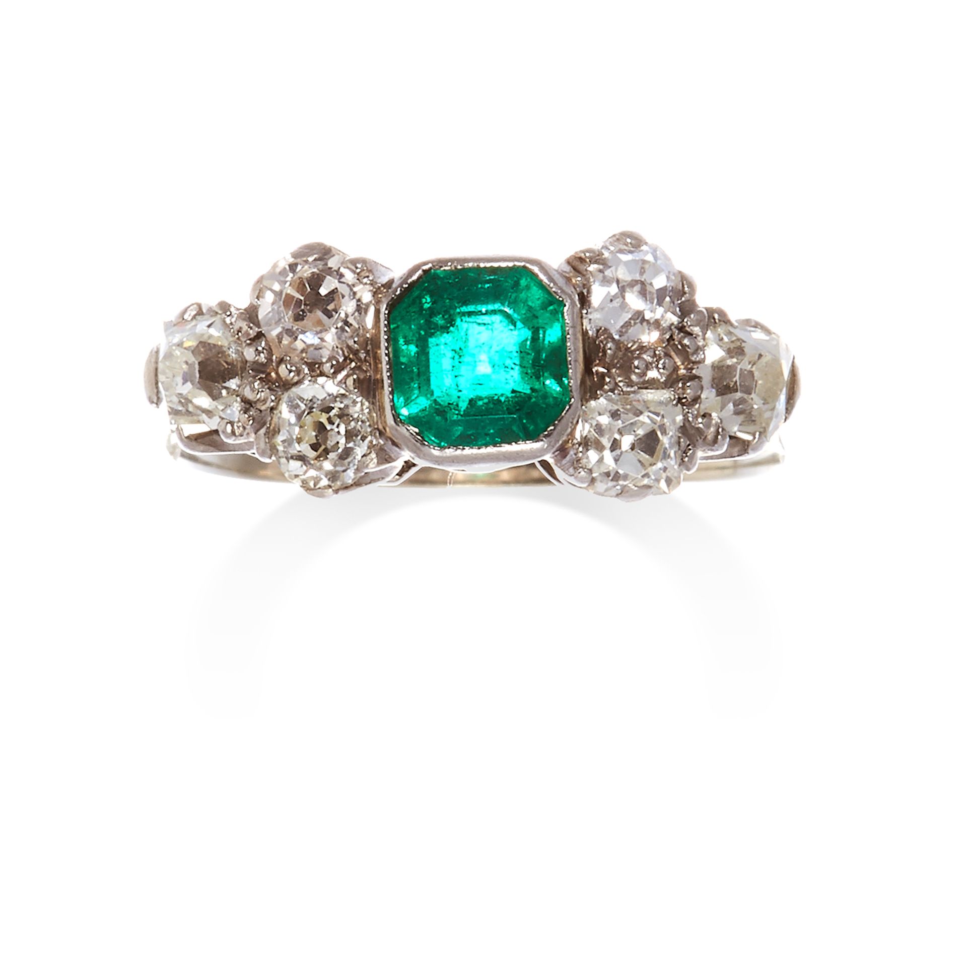 AN EMERALD AND DIAMOND RING in platinum or white gold, the central step cut emerald between old