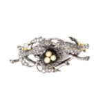 AN ANTIQUE DIAMOND AND PEARL BIRDS NEST BROOCH in 18ct yellow gold and silver, designed as a tree