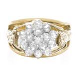 A VINTAGE DIAMOND DRESS RING, CIRCA 1940 in yellow gold, the floral motif centre jewelled with