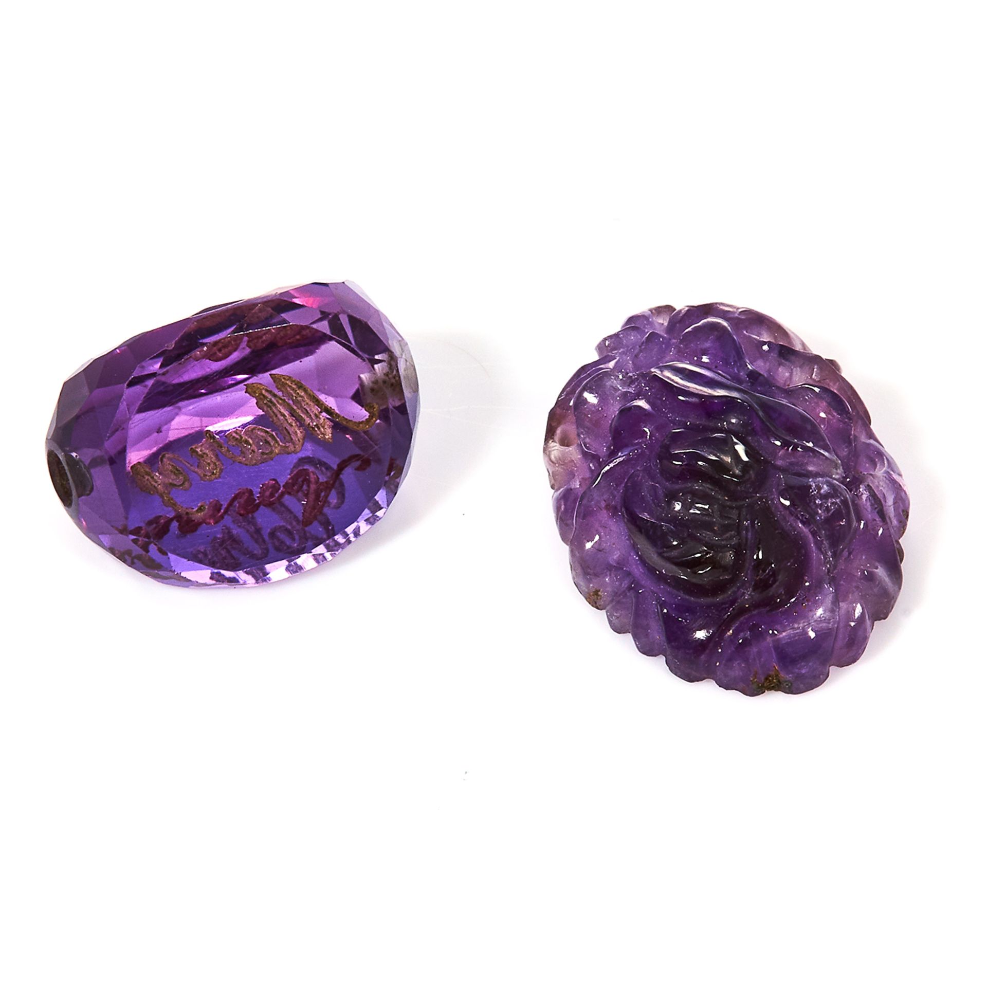 A 22.75 CARAT PARCEL OF AMETHYSTS carved and faceted.