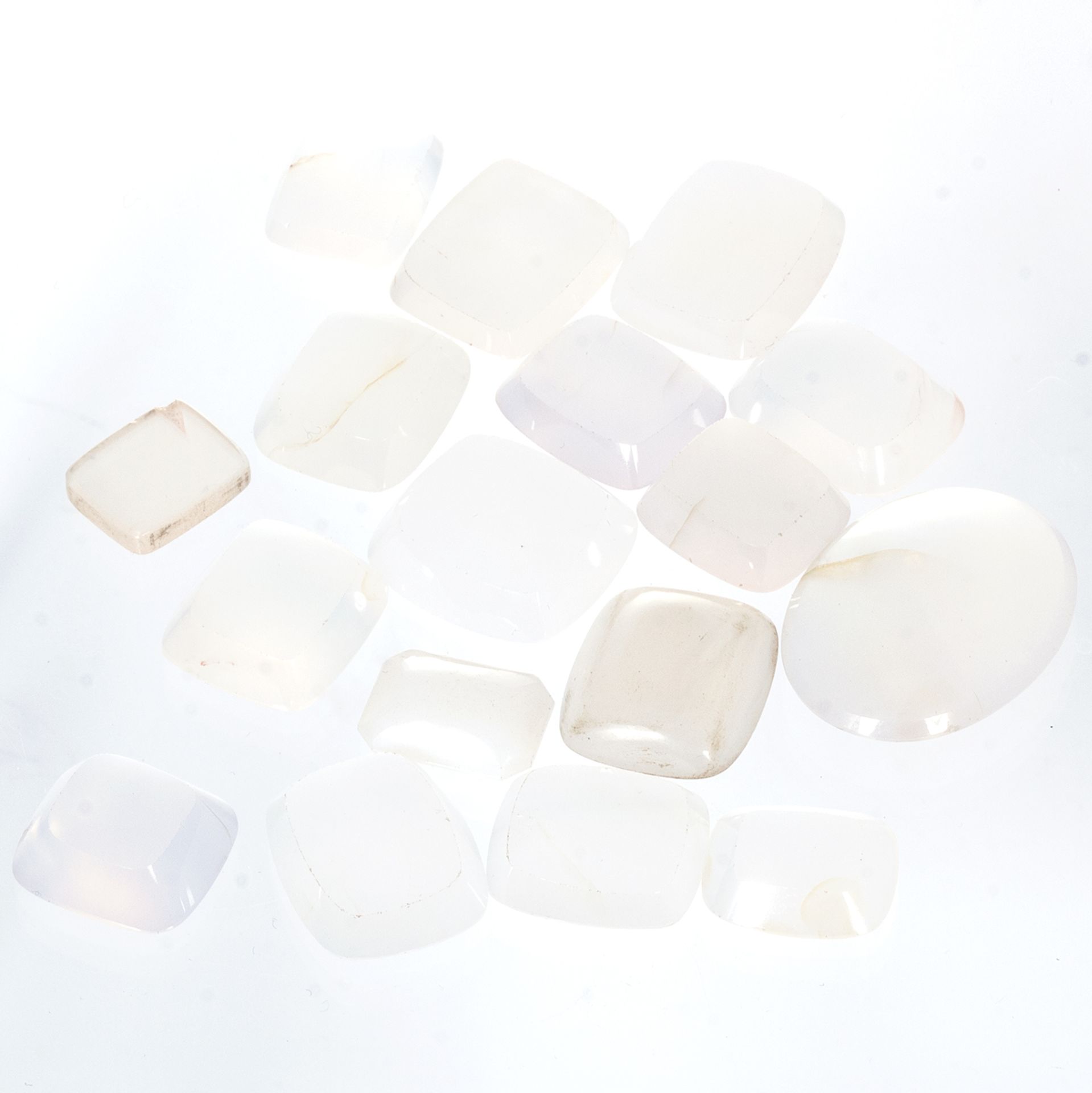 A 276.0 CARAT PARCEL OF WHITE CHALCEDONY variously shaped and sized, mostly for carved seal /