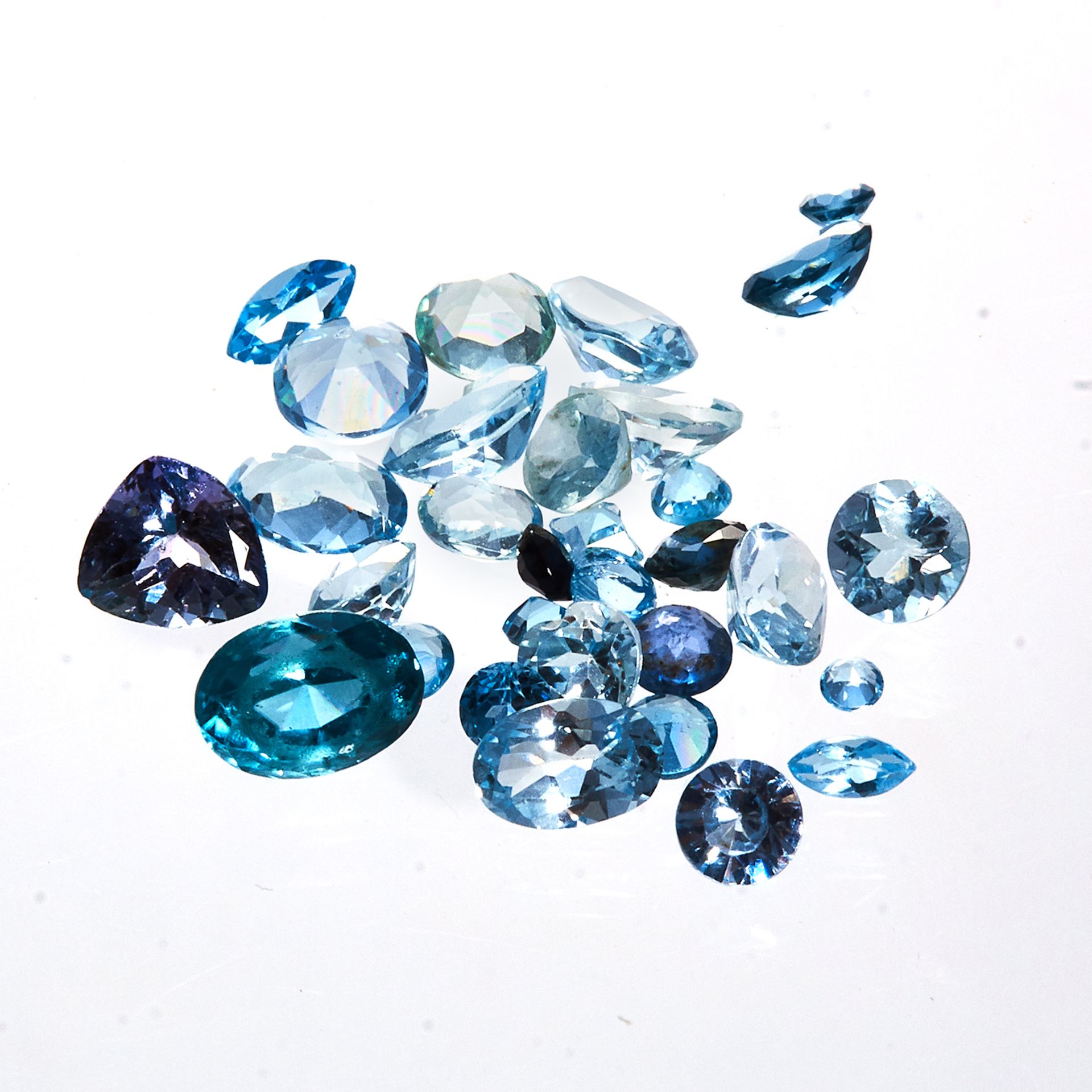 A 10.0 CARAT PARCEL OF BLUE GEMSTONES possibly to include topaz, aquamarine, zircon, etc.