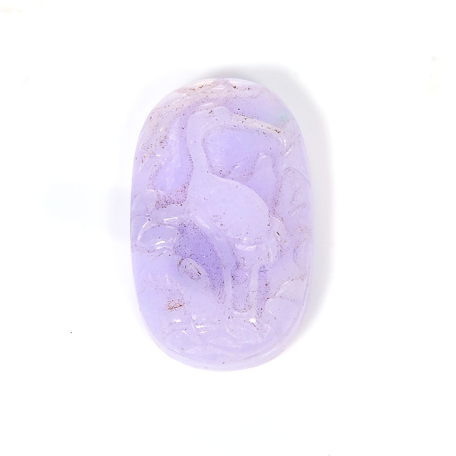 AN CARVED CHINESE LAVENDER JADE JEWEL oval, carved in high relief depicting a stork among reeds,