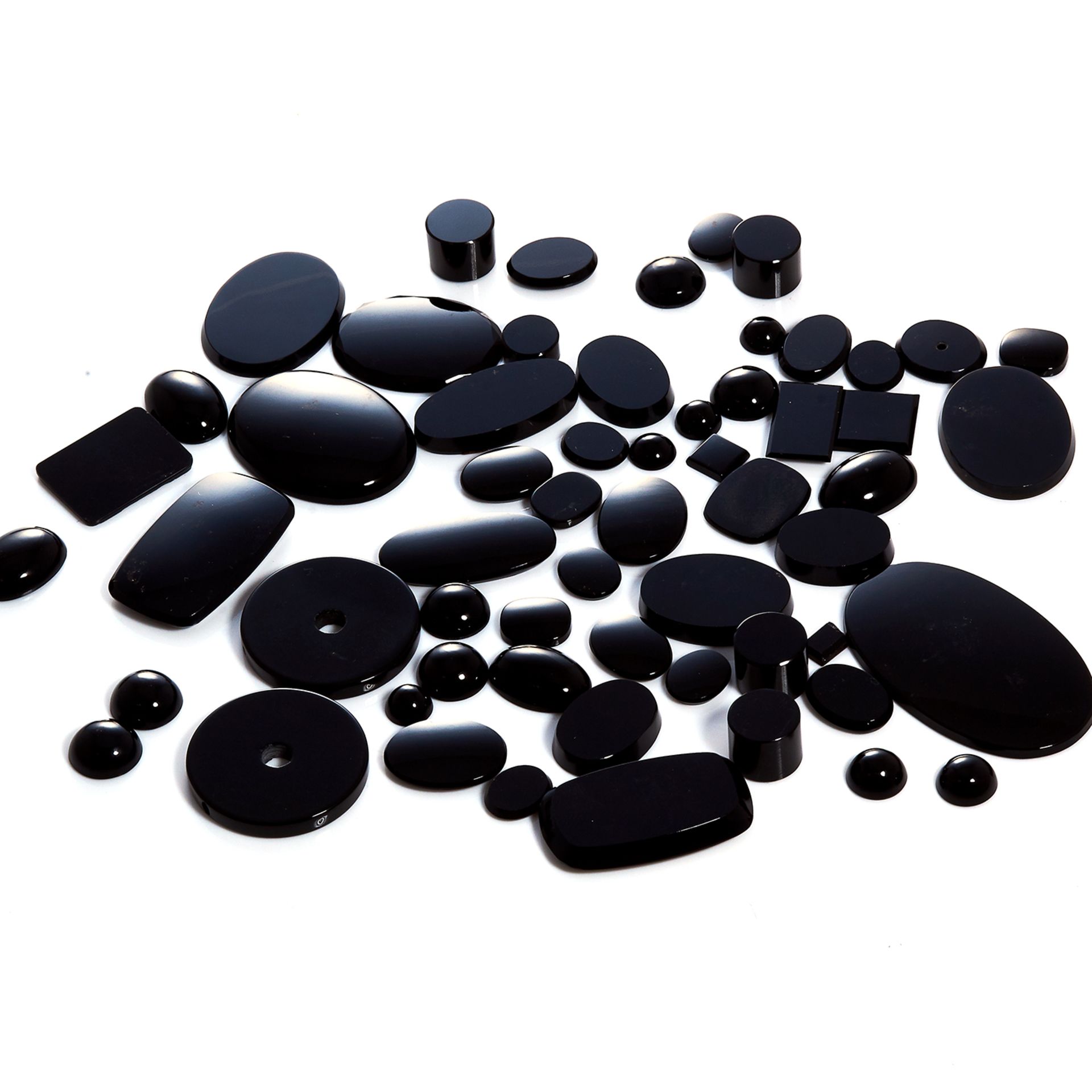 A 593.80 CARAT PARCEL OF POLISHED HEMATITE including slabs, discs, cabochons, etc.