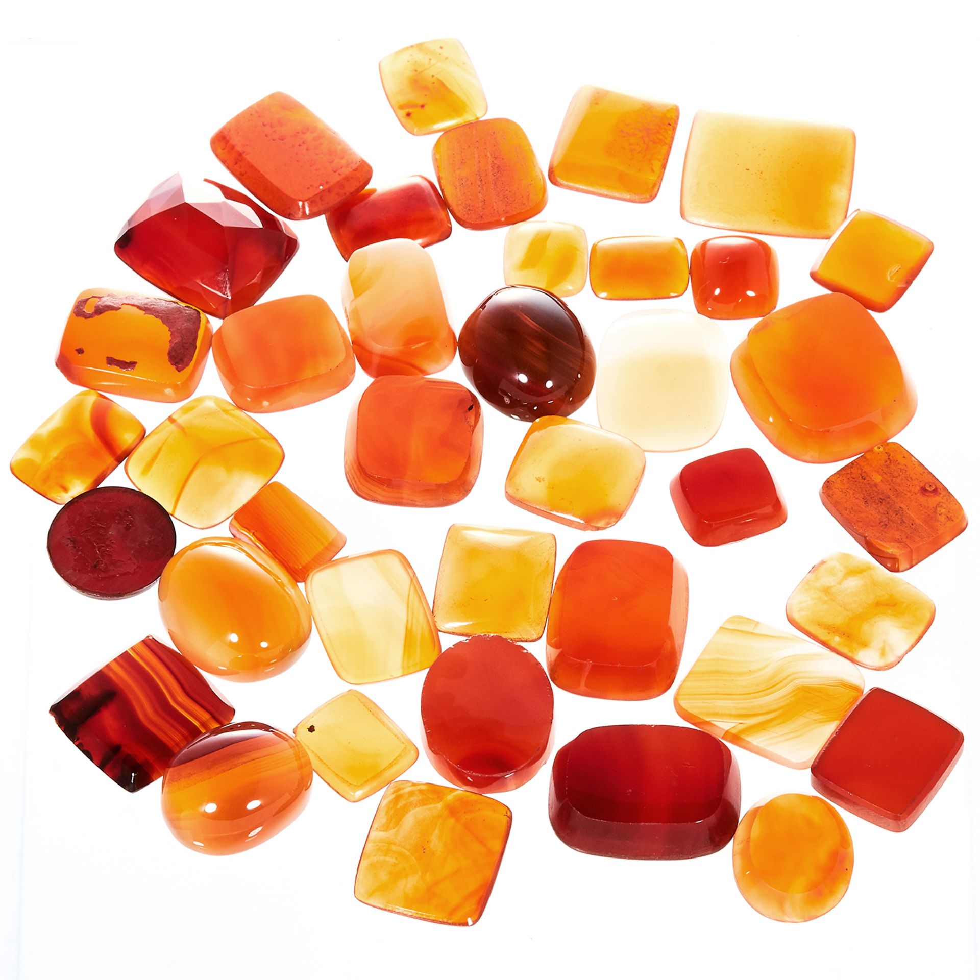 A 511.0 CARAT PARCEL OF CARNELIAN variously sized and shaped including plaques for carved seals /