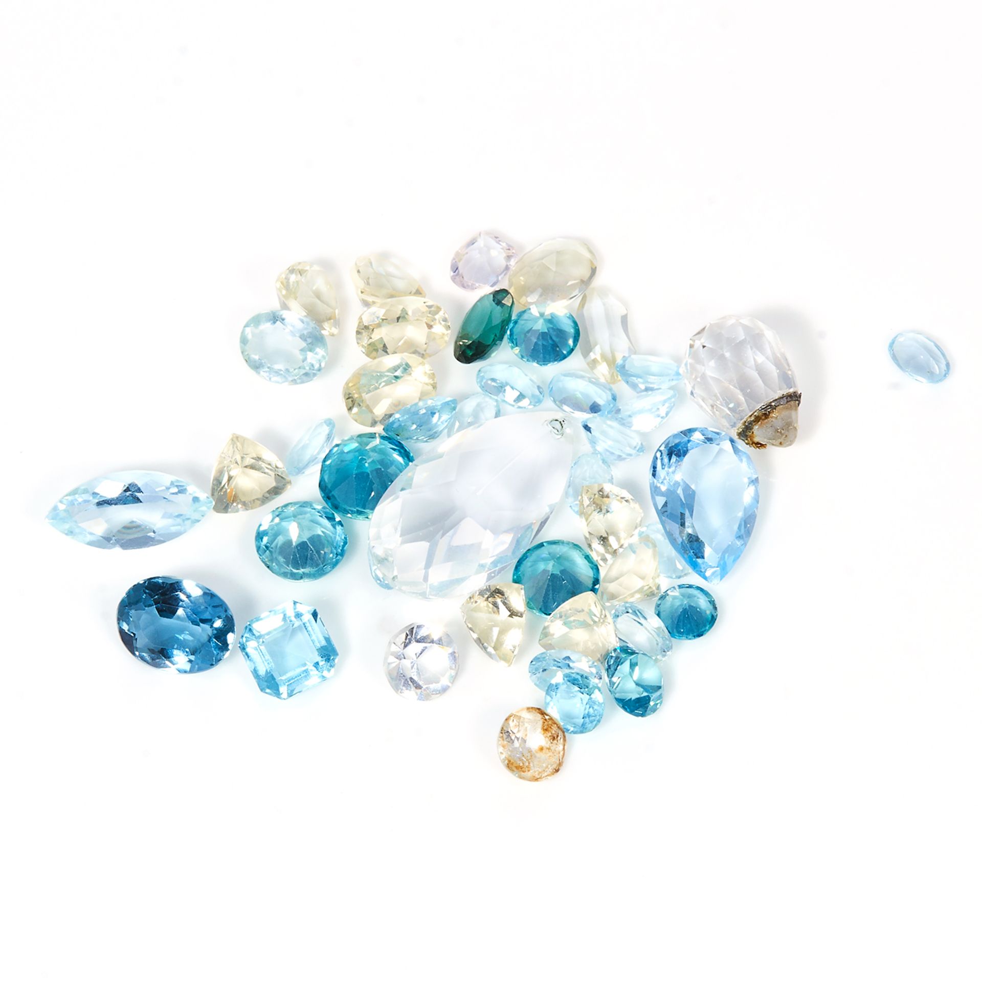 A 64.85 CARAT PARCEL OF GEMSTONES including topaz, zircon, aquamarine, etc.