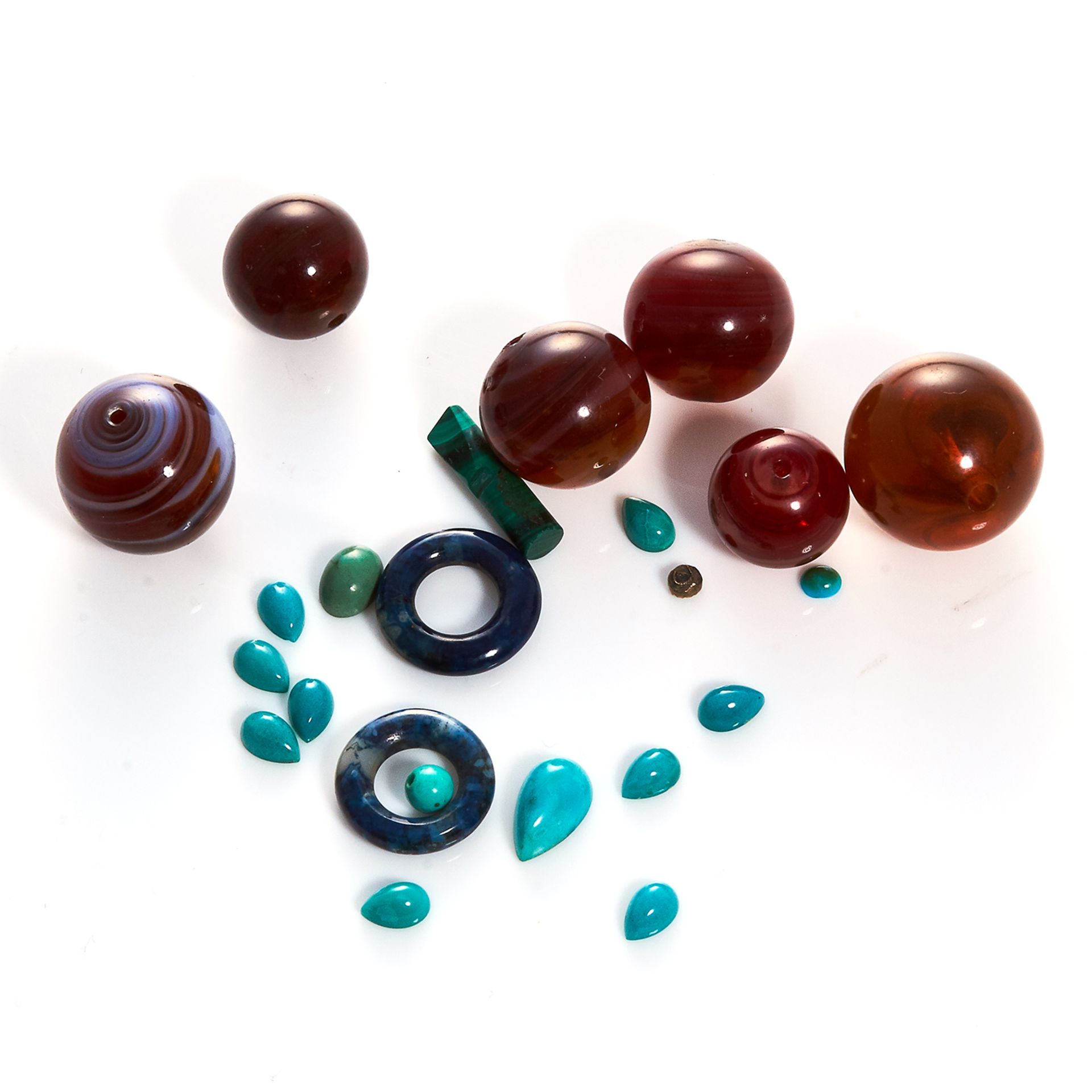 A 144.35 CARAT PARCEL OF TURQUOISE AND BANDED AGATE including beads and cabochons.