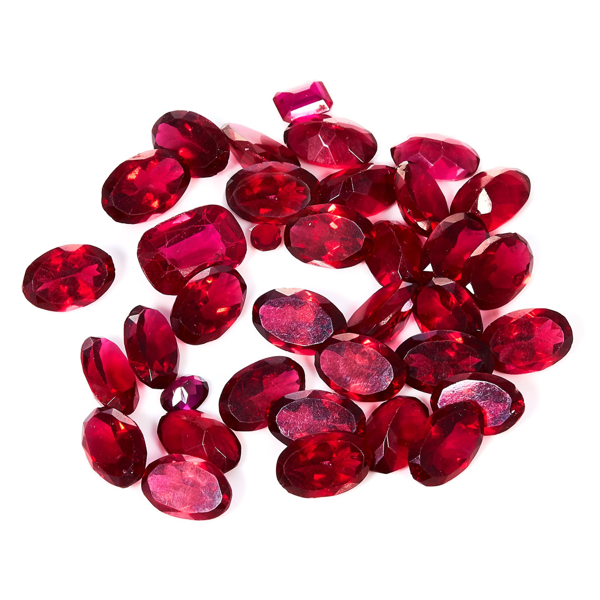 A 216.35 CARAT PARCEL OF RED GEMSTONES various shapes and sizes