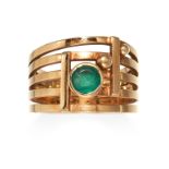 AN EMERALD DRESS RING in high carat yellow gold, the split band set with a round cut emerald between