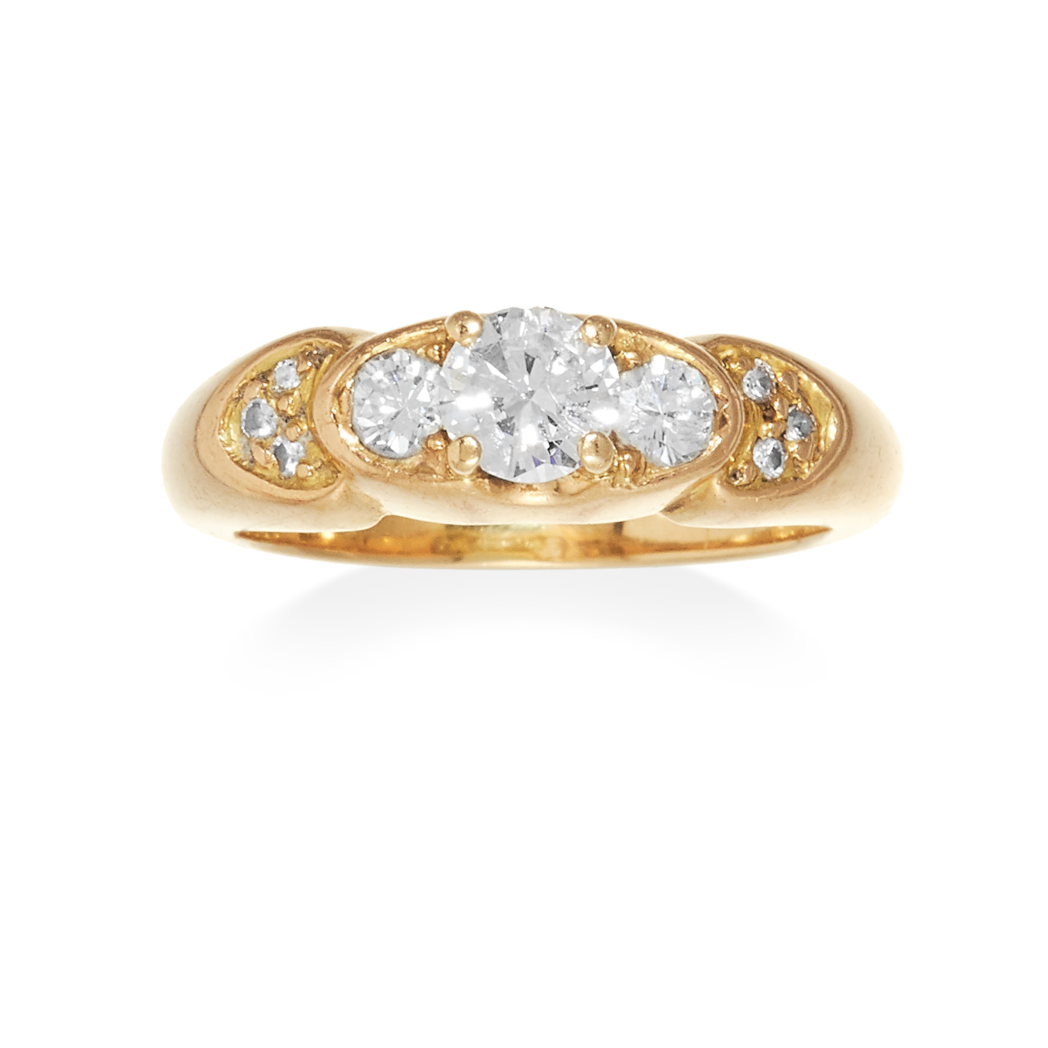 A THREE STONE DIAMOND DRESS RING in high carat yellow gold, set with three round cut diamonds