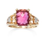 A PINK TOURMALINE AND DIAMOND DRESS RING in 9ct yellow gold, set with a central faceted red stone