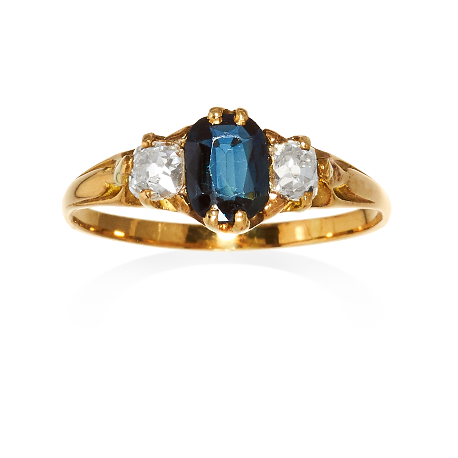 AN ANTIQUE SAPPHIRE AND DIAMOND THREE STONE RING in high carat yellow gold, the oval cut sapphire