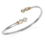 A GEMSET STERLING SILVER BANGLE with 9ct gold accents, set with four clear gems, 6cm, 4.50g.