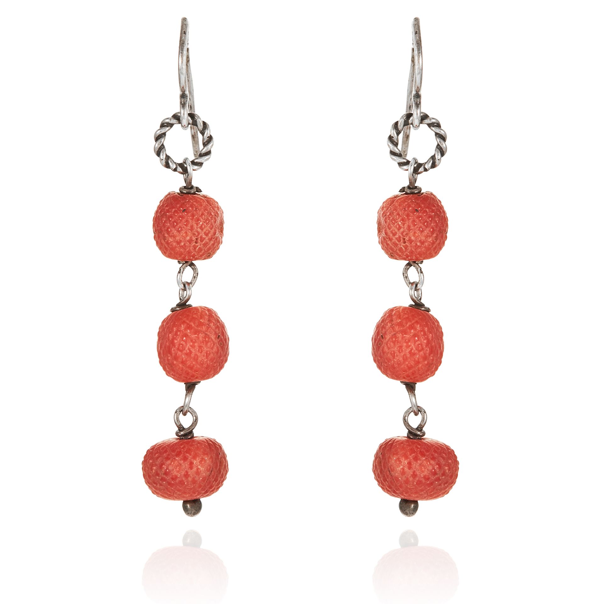 A PAIR OF ANTIQUE CARVED CORAL BEAD EARRINGS in sterling silver, each jewelled with three carved