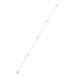 A DIAMOND BRACELET, TIFFANY & CO in 18 carat yellow gold, a fine gold chain holding three round