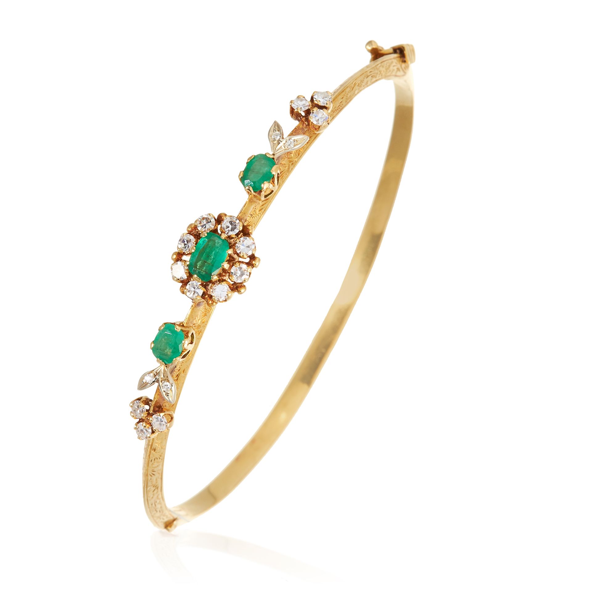 AN ANTIQUE EMERALD AND DIAMOND BANGLE in high carat yellow gold, comprising of three central oval