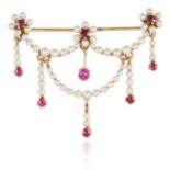 AN ANTIQUE PEARL AND RUBY BROOCH in yellow gold, comprising of floral and ribbon motif, jewelled
