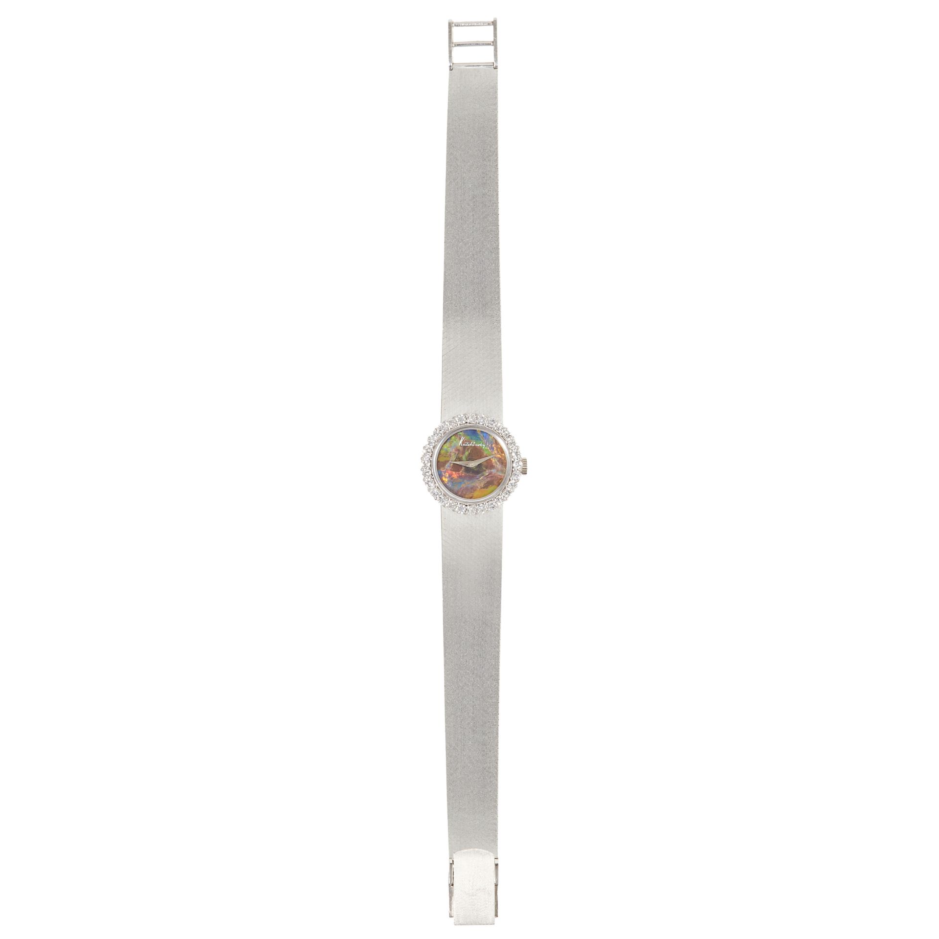 A VINTAGE BLACK OPAL AND DIAMOND COCKTAIL WATCH, KUTCHINSKY, CIRCA 1971 in 18ct white gold, with