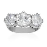 AN ANTIQUE 5.50 CARAT DIAMOND THREE STONE RING in platinum or white gold, set with three graduated