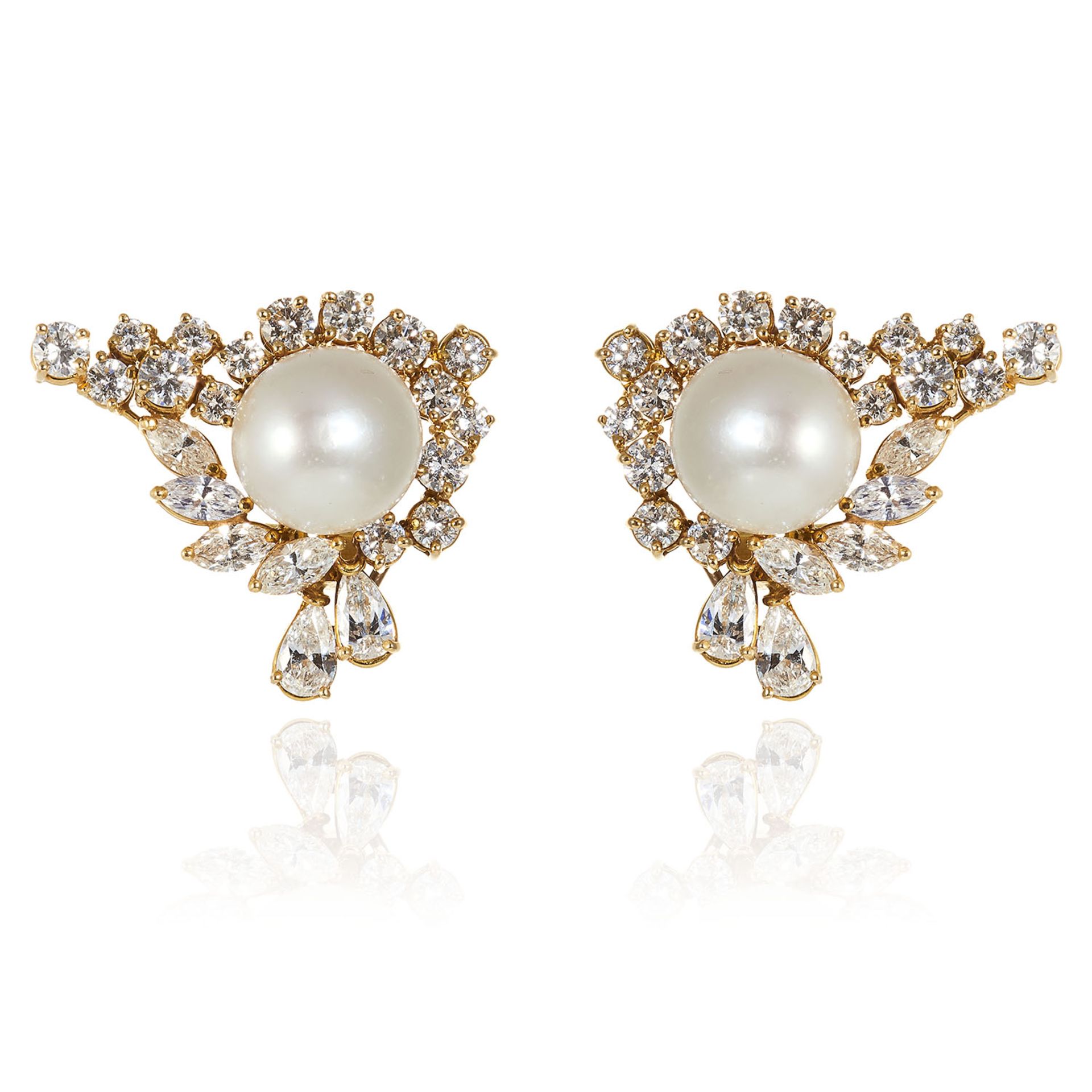 A PAIR OF VINTAGE PEARL AND DIAMOND EARRINGS in 18ct yellow gold, each comprising of central pearl