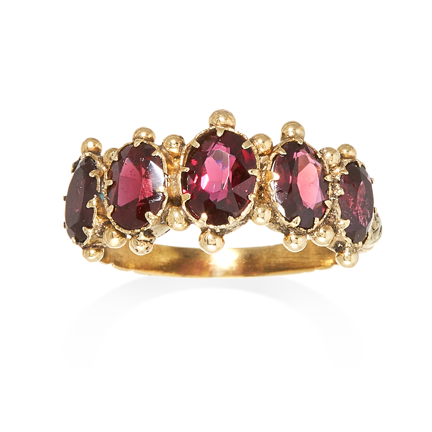 AN ANTIQUE GARNET FIVE STONE RING in yellow gold, comprising of five oval cut garnets with