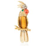 A VINTAGE TIGERS EYE, CORAL, EMERALD AND DIAMOND BIRD BROOCH in 18ct yellow gold, depicting a