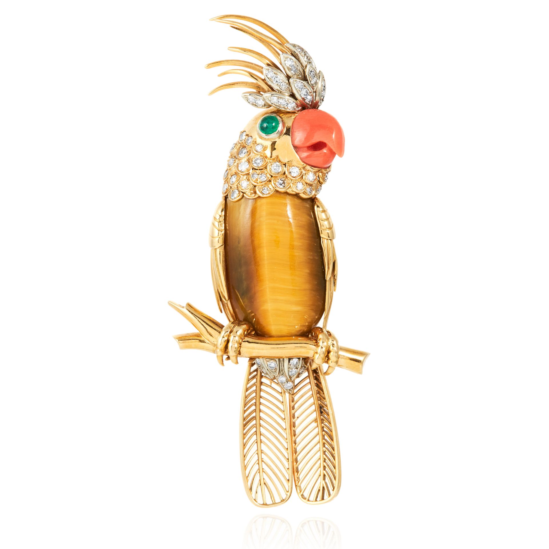 A VINTAGE TIGERS EYE, CORAL, EMERALD AND DIAMOND BIRD BROOCH in 18ct yellow gold, depicting a