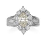 A DIAMOND DRESS RING in platinum, comprising of a marquise cut diamond framed by a border of round