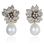 A PAIR OF SOUTH SEA PEARL AND DIAMOND EAR CLIPS in platinum, designed as a flower, comprising of