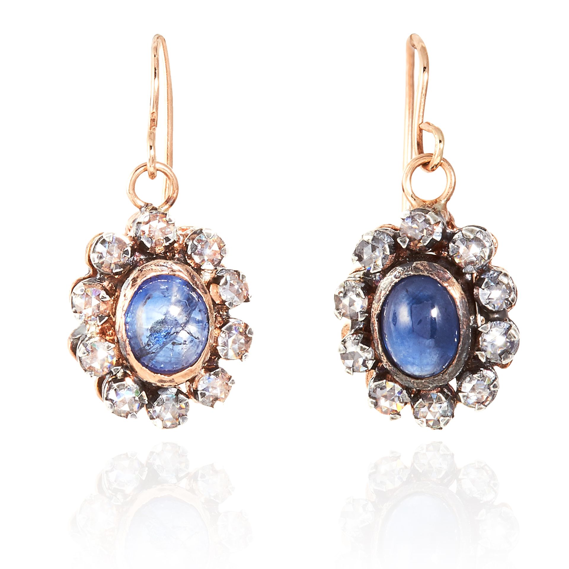 A PAIR OF ANTIQUE SAPPHIRE AND DIAMOND EARRINGS in yellow gold and silver, each with a cabochon