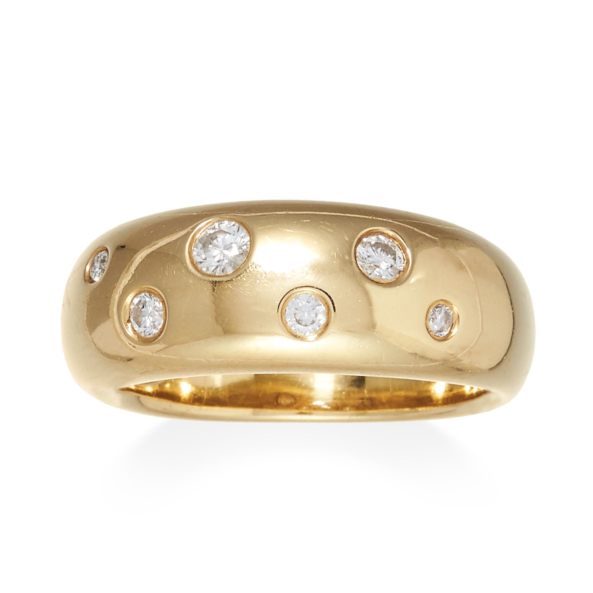 A DIAMOND BOMBE RING in 18ct yellow gold, jewelled with six round cut diamonds, stamped 18K, size