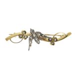 AN ANTIQUE DIAMOND AND PEARL SWALLOW BROOCH in yellow gold, the undulating bar set at the centre