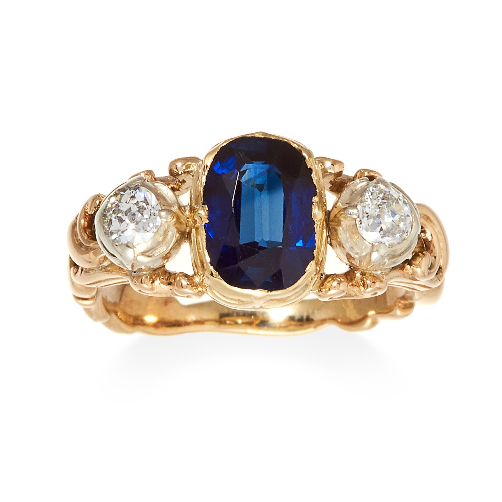 A SAPPHIRE AND DIAMOND THREE STONE RING, in yellow gold, set with a central oval cut sapphire of