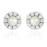 A PAIR OF DIAMOND AND PEARL STUD EARRINGS in 18 carat white gold, jewelled with round cut diamonds