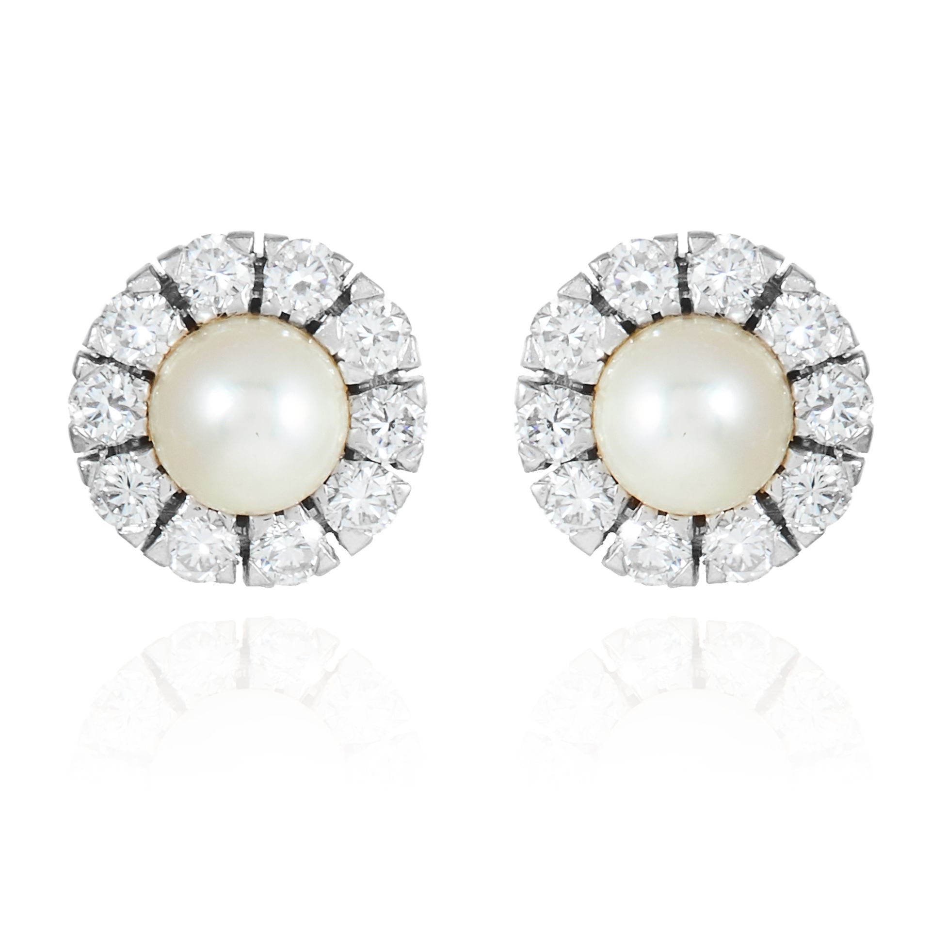 A PAIR OF DIAMOND AND PEARL STUD EARRINGS in 18 carat white gold, jewelled with round cut diamonds