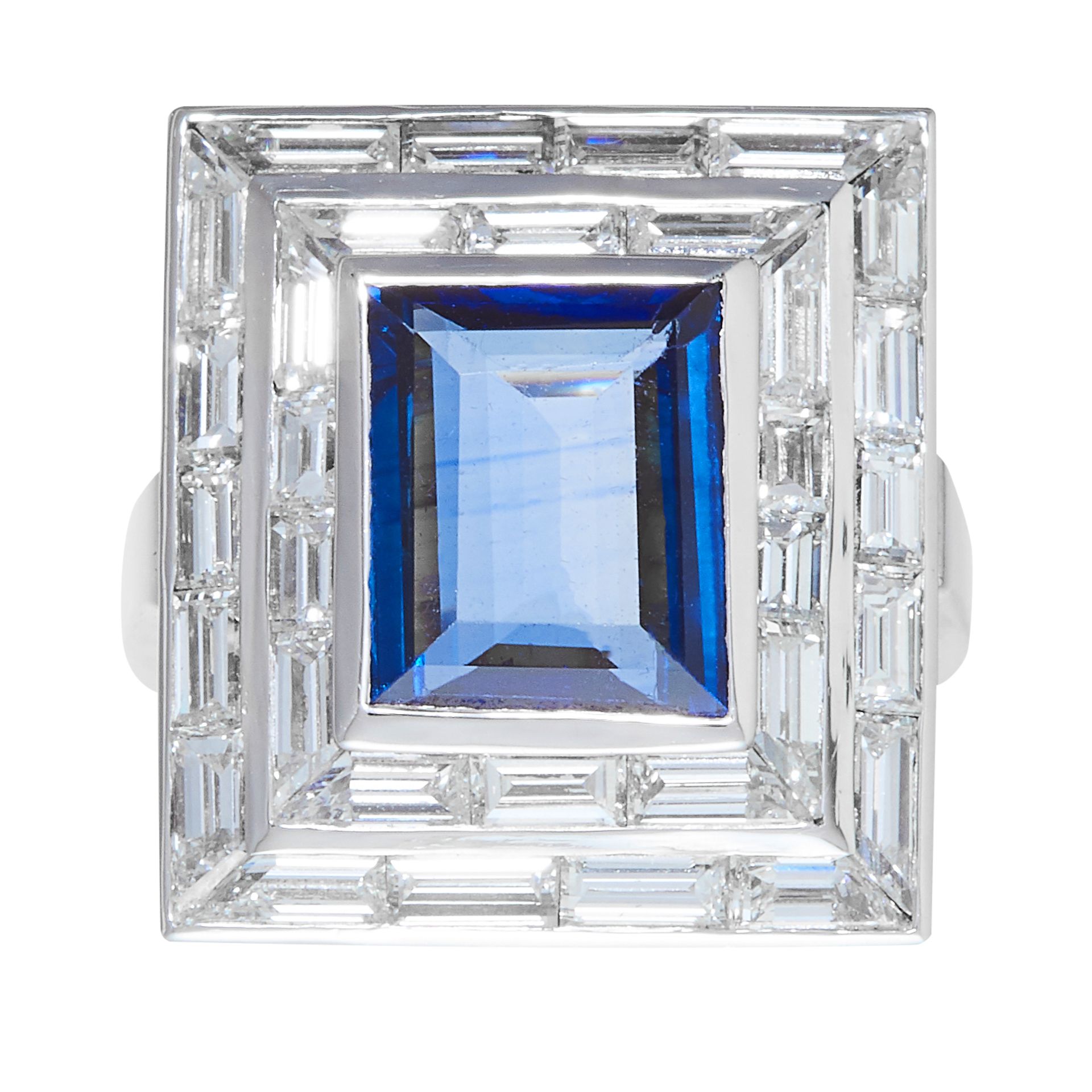 A 4.40 CARAT SAPPHIRE AND DIAMOND RING in gold or platinum, the rectangular face is set with an