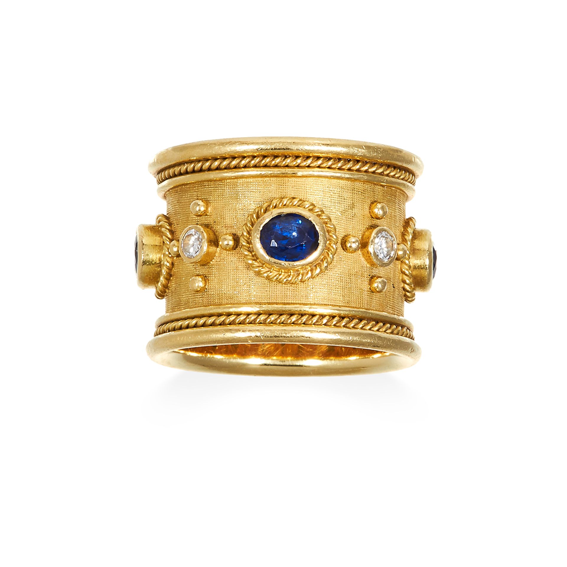 A SAPPHIRE AND DIAMOND RING, ELIZABETH GAGE, CIRCA 1993 in 18ct yellow gold, the wide textured
