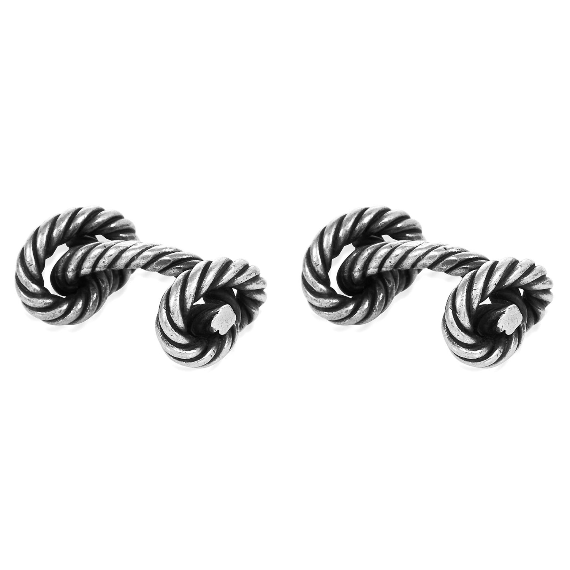 A PAIR OF KNOTTED ROPE CUFFLINKS, HERMES in silver, designed as knotted rope, signed Hermes,