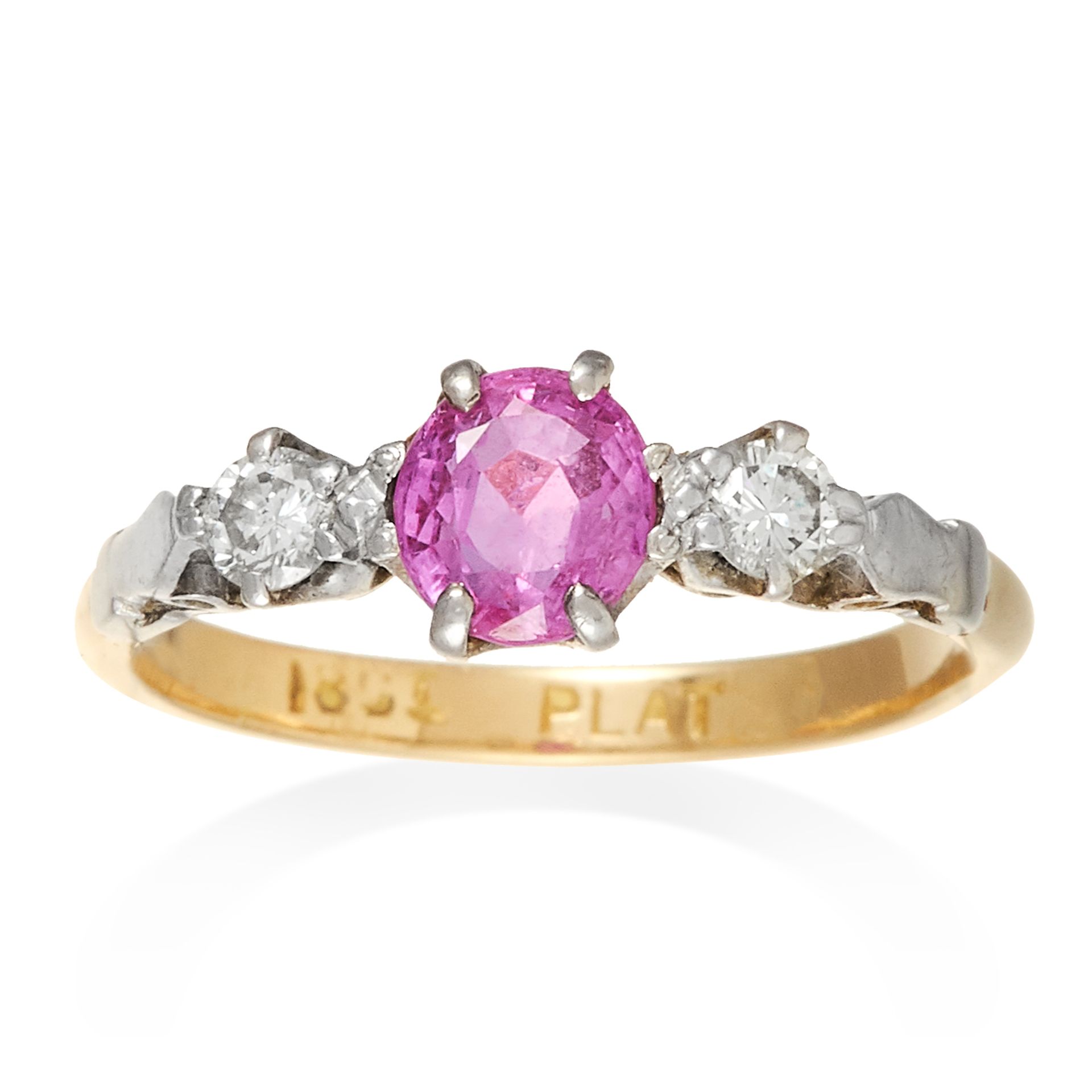 AN ANTIQUE PINK SAPPHIRE AND DIAMOND THREE STONE RING in 18ct yellow gold and platinum, the oval cut