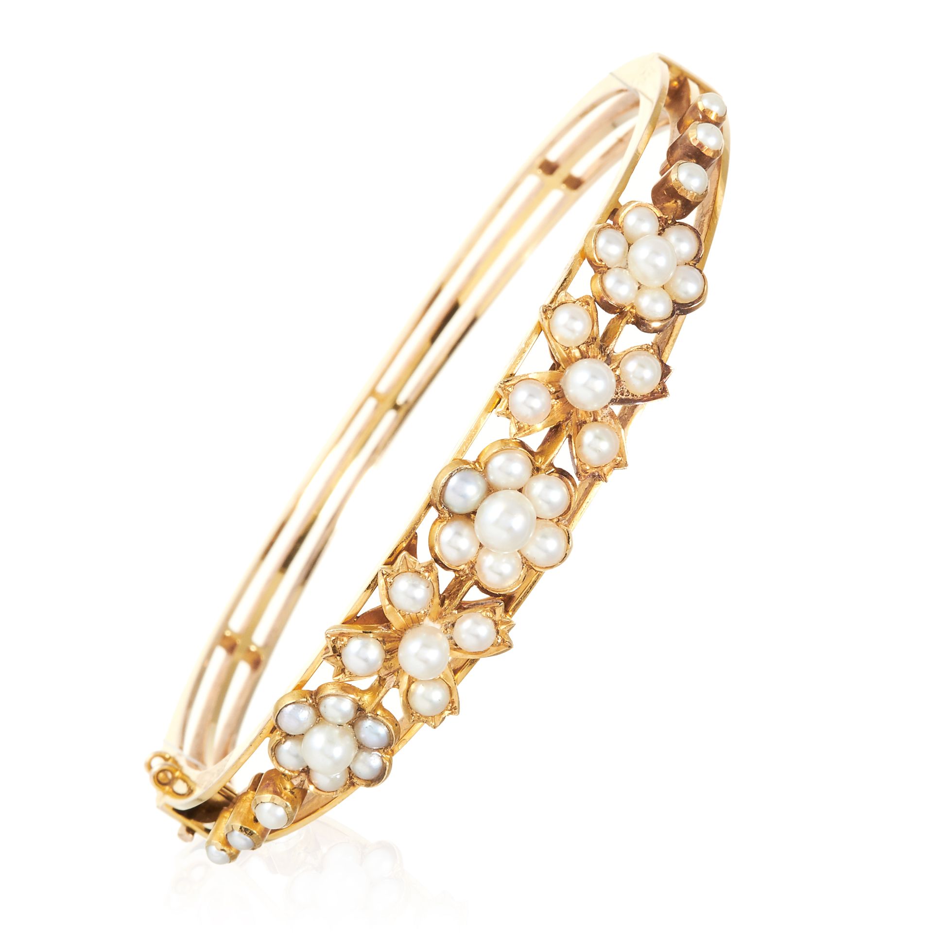 AN ANTIQUE PEARL BANGLE, 19TH CENTURY in high carat yellow gold, the floral and leaf motifs jewelled