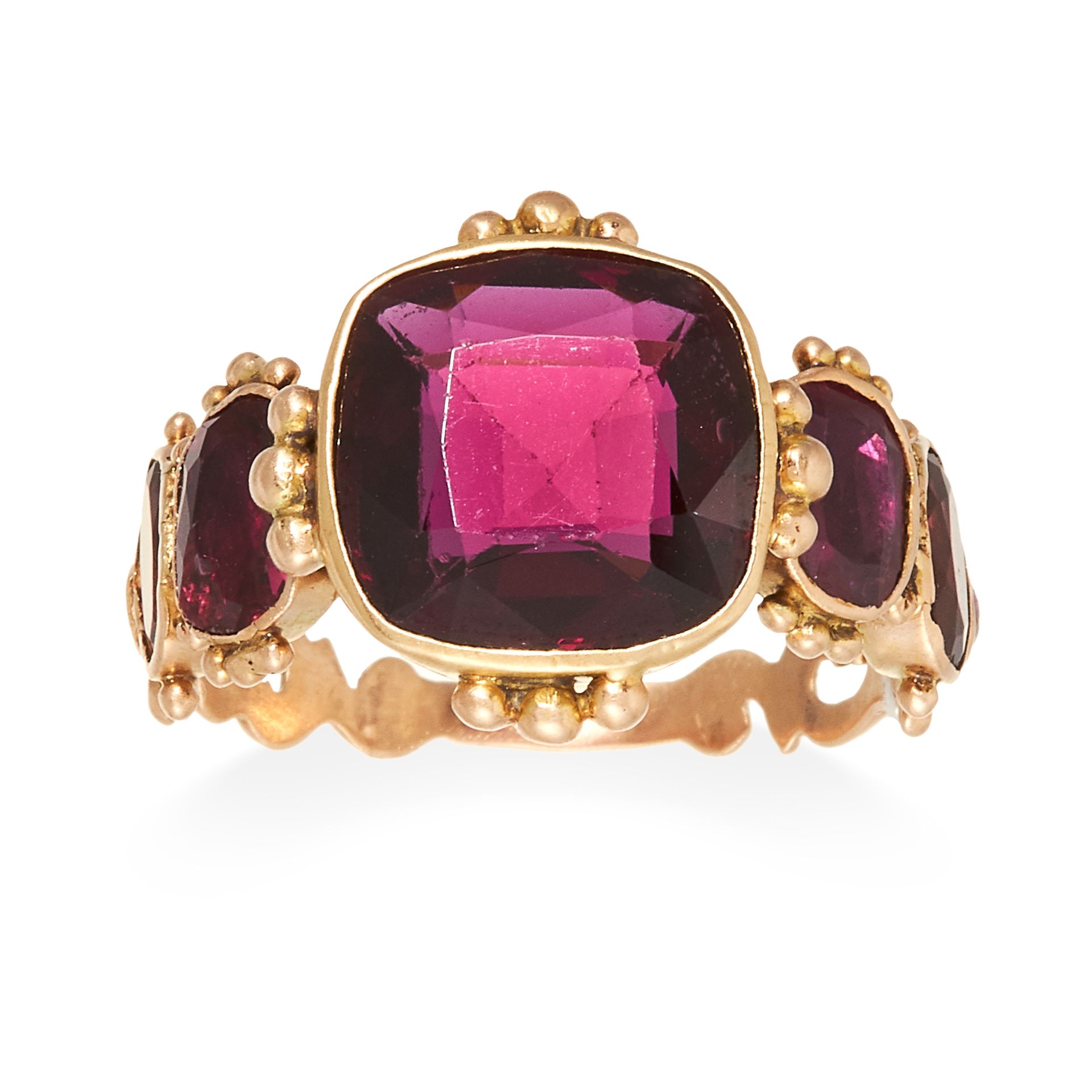 AN ANTIQUE GARNET RING, 19TH CENTURY in high carat yellow gold, set with a central cushion cut