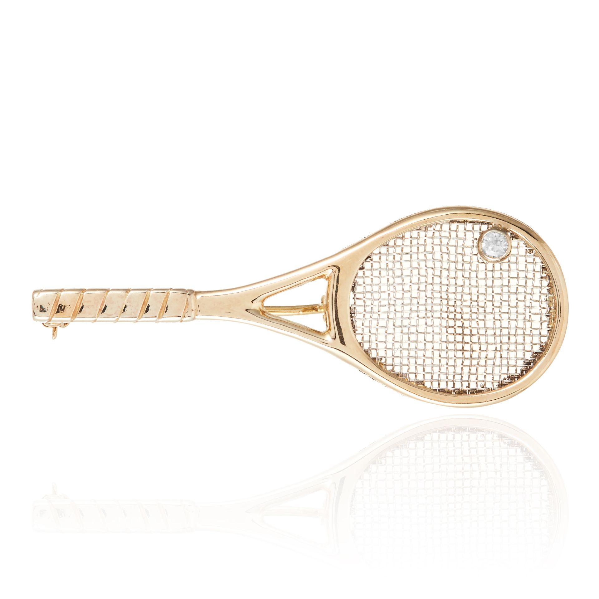 A DIAMOND NOVELTY TENNIS BROOCH in 9ct yellow gold, designed as a tennis batt, jewelled with a round
