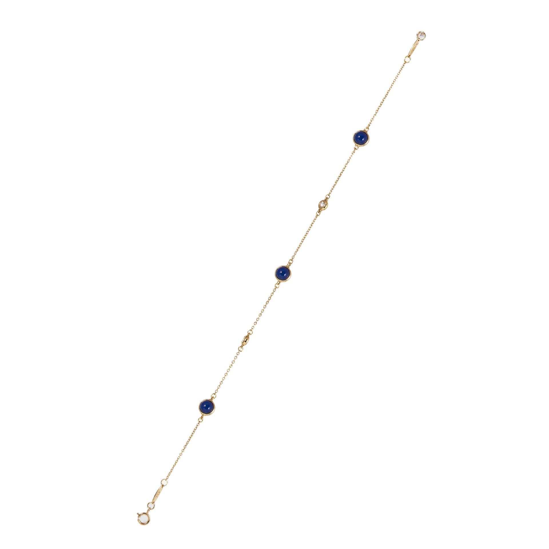 A LAPIS LAZULI AND DIAMOND BRACELET, TIFFANY & CO in 18 carat yellow gold, a fine gold chain holding