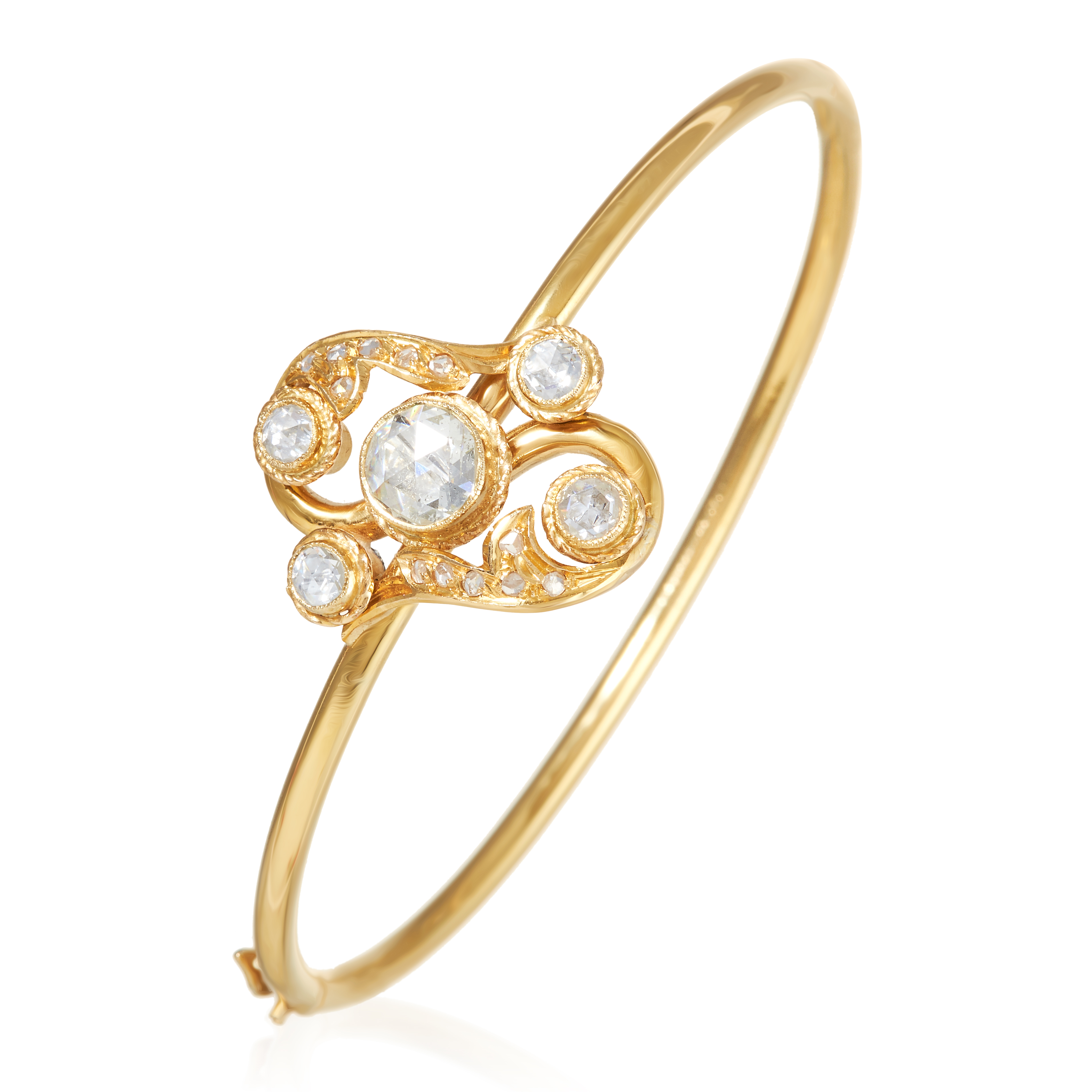 AN ANTIQUE DIAMOND BANGLE in high carat yellow gold, the Art Nouveau design formed of a scrolling